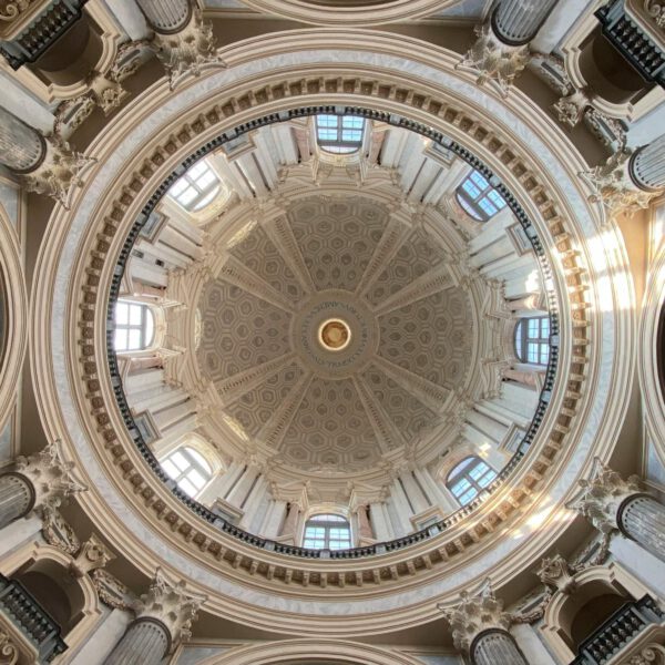 Ceiling view of the Basilica of Superga in Turin, Italy, showcasing architectural grandeur.